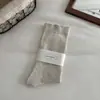 Calcetines de mujer sin costuras para primavera y otoño, calcetines blancos postparto de caña suelta, calcetines holgados de color liso estilo japonés, calcetines largos minimalistas