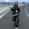 Conjunto de Moda de Bloques de Color Negro y Gris para Niñas Primavera y Otoño 2026 Nuevo Conjunto de Dos Piezas Trendy Holgado de Sudadera y Pantalones Deportivos para Niños