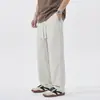Pantalones casuales de seda helada negra elástica de secado rápido con sensación de frescura para hombre, nuevo modelo de verano 2026, cintura elástica, pantalones de pierna recta holgados