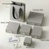 Caja de joyería de lujo ligero con asa de perla texturizada y diseño acanalado, textura de caja dura, adecuada para pendientes, pulseras y empaque de regalo; disponible en stock
