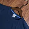 Artículo de stock 180g algodón puro azul a rayas de verano, cuello redondo manga corta camisa cultural personalizada, uniforme de clase, camiseta, casual y cómoda