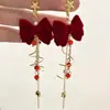 Brincos de meteoros rotativos Outono e inverno Ano Novo Brincos de laço vermelho Design de nicho doce Sense Ear Clip Mulheres