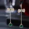 Joias europeias e americanas com pingente longo de esmeralda, laço de metal, diamantes, brincos de temperamento simples, fornecimento direto de fabricantes femininos