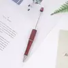 Fabricante criativo de caneta de miçangas DIY em estoque venda quente Amazon giratória atacado caneta esferográfica de plástico com miçangas imprimível