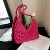 Versão coreana 2026 nova bolsa versátil simples feita à mão em crochê/tecelagem, bolsa de bolinho para feriado, bolsa de ombro nicho, bolsa feminina fashion