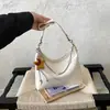 Bolso de axila para mujer, nuevo bolso tipo bola de masa de otoño 2026, de alta gama, vintage, exquisito, bolso de hombro para ir al trabajo, bolso cruzado