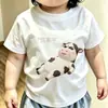 2026 algodón puro cuello redondo verano niños abstracto nicho estampado de vaca bebé manga corta camiseta top tendencia
