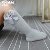 Calcetines de tubo con lazo para niña, calcetín coreano de algodón de color liso para bebé, venta al por mayor, otoño