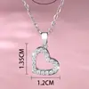Collar cruzado clásico con corazón de circón, colgante de corazón hueco de lujo ligero para uso diario con incrustación de circón