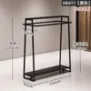 Estante de Exhibición para Tienda de Ropa de Hierro Minimalista Negro Montado en Pared Perchero de Ropa para Tienda de Ropa de Mujer Estante de Ropa de Pared Modelo Nuevo