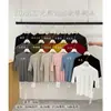 Yuanxi - Nueva Llegada de Otoño Estilo Coreano Textura Versátil Adelgazante Favorecedor Temperamento Multicolor Cuello Semi Alto Manga Corta Camiseta Mujer 4046