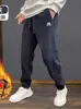 Pantalones deportivos para hombre de marca de moda transfronteriza, estilo otoño e invierno, engrosados y con forro polar, pantalones jogger casuales de corte holgado para hombre