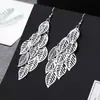 ¡Guau!Moda Transfronteriza Europea y Americana, Varios Pendientes Largos Metálicos de Borla Exagerada de Estilo Moderno con Elementos Elegantes