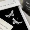 Moderna y Versátil Exquisita Súper Brillante Micro-Incustada Circonita Moño Plateado Aretes de Botón Colección Nicho Lujo Pendientes de Alta Gama