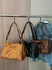 Bolsa de Plumas para Mujer Otoño e Invierno 2025 Nueva Tendencia Coreana Acolchada Cuadrada Pequeña Bolso Versátil de Gran Capacidad para Hombro Cruzado