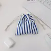 48151 Bolsa con cordón de dibujos animados para guardar artículos diversos para estudiantes, neceser portátil para cosméticos y pintalabios