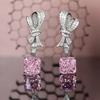 Cruz-border high-end jóias Raydeon brincos de corte Super Flash diamante rosa Flor de Gelo corte cheio de diamante arco brincos atacado