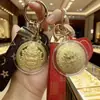 Oro Puro 999 Amarillo Dios de la Riqueza Disco Colgante de Oro Llavero Cadena de Teléfono Decoración para Bolso Venta al por Mayor para Hombres y Mujeres