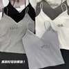 Camisola de moda para mujer con espalda descubierta calada y hermosa, top de tubo de encaje de deseo puro para mujer con copas, top sin mangas acanalado versátil, venta al por mayor
