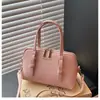 Bolso tipo concha casual y elegante de diseño único, nuevo modelo primavera 2026, bolso de hombro y cruzado simple de moda para mujer