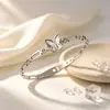 Pulseira de aço titânio com coração de borboleta em madrepérola e cruz, pulseira versátil de luxo leve e que não desbota, diretamente da fábrica de origem