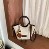Bolsos Nuevos Otoño 2026 Para el Trabajo de un Solo Hombro Bolso Cruzado de Moda Estilo Coreano Nicho Bolso de Cubo Sencillo de Mano Bolso para Mujer