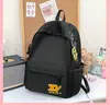 Mochila bordada retrô moderna estilo americano desgastada para estudantes, leve, versátil, de grande capacidade, adequada para o dia a dia.