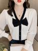 Outono estilo francês design laço manga bufante costura malhas femininas chique decote em V elegante emagrecimento top