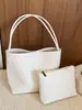 Bolsa de ombro retrô minimalista, bolsa casual de design nichado, novo estilo de verão 2026, bolsa única feminina de ombro