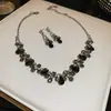Traje de collar y pendientes de diamante ovalado europeo y americano exagerado luz de lujo alta gama cadena de clavícula nicho moda joyería al por mayor