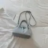 Bolso pequeño elegante y atractivo estilo coreano modelo nuevo 2026 bolso de mano de color liso bolso cruzado con patrón tejido bolso de mano exquisito