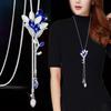 Collar largo de cadena para suéter con accesorios florales transfronterizos para mujer, colgante de borla de cristal, colgante para ropa, joyería simple al por mayor