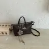 Bolso cruzado de diseño nicho coreano transfronterizo con textura tejida para mujer, moda simple de color liso, elegante, moderno, de un solo hombro