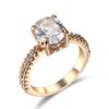 Joyería transfronteriza Joyería de moda europea y americana popular anillo de cobre de cuatro garras con incrustaciones de circón para mujer anillo simple de personalidad chapado en oro