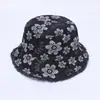 Nuevo sombrero de pescador de mezclilla japonés y coreano moda sombrero de sol con flores venta al por mayor 2024 primavera y verano protector solar ala ancha sombrero tipo cubeta transfronterizo
