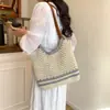 Bolso de mano tejido a mano artístico calado de nicho transfronterizo, bolso de hombro versátil, bolso de playa de gran capacidad para vacaciones junto al mar