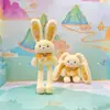 Jinnew Original Nuevo Estilo Chino Divertido Colgante de Peluche de Conejo Desplegable Llavero de Conejo de Orejas Tirables Muñeca Venta al por Mayor
