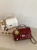 Bolsa de mão acolchoada estilo Chanel para mulheres, versátil e elegante, cor sólida, de ombro e transversal, verão 2026.