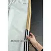 Pantalones de chándal a rayas estilo americano personalizados, holgados y fluidos, con bordado de color contrastante, pantalones de chándal deportivos casuales para hombre para otoño