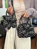 Bolso de mano de moda transfronterizo con lunares frescos, bolso tipo concha versátil de diseño nicho y moderno, bolso cruzado casual dulce con estampado floral
