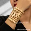 Moda Punk Europeo y Americano Mano Abierta Decorada Pulsera Ancha Hueca de Metal Pulsera Exagerada de Metal Anillo para el Brazo