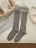 Calcetines blancos para mujer otoño e invierno Nuevo color puro presión adelgazante calcetines de pantorrilla Japonés jk dulce alto medias cálidas moda