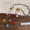Collar de cuentas de corazón colorido estilo étnico para mujer, diseño de nicho, estilo largo con sensación de alta gama, cadena para la clavícula de doble capa de cuerda trenzada marrón