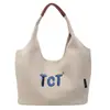 Bolsa tote de lona de cor sólida de alta qualidade para mulheres, nova de 2026 para o verão, grande capacidade, para o trabalho, simples, com letras, de ombro