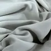 Poliéster satén cepillado color durazno tela para ropa y textiles del hogar poliéster satén piel de durazno cepillada tela para pantalones de playa venta al por mayor