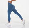 Pantalones de yoga deportivos de tejido sin costuras que realzan la cadera y absorben la humedad, de gran venta en Europa y América, leggings sexys que muestran la cadera para mujer