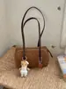 Nova bolsa bowling de bolinhas outono/inverno 2026, bolsa tote estilosa e moderna, bolsa de ombro e bolsa de axila para trabalho e deslocamento