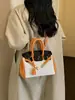 Bolso de mano de alta gama para mujer, nuevo modelo 2026, bolso Kelly de moda transfronterizo, bolso de hombro y cruzado casual para el trabajo, color platino