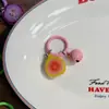 Llavero colorido de frutas con cascabeles, sandía, granada, guayaba, colgante de juguete de comida en miniatura, accesorio versátil para bolso