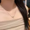Collar con colgante de lazo de cobre ecológico con circonita de doble capa, versátil como cadena para la clavícula para el uso diario